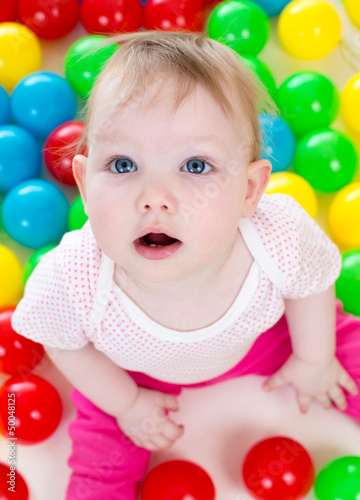 Portrait of funny baby play...