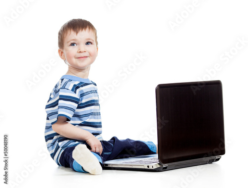 baby boy using a laptop ove...