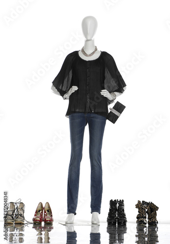 female clothing in jeans with bag and shoes on mannequin photo