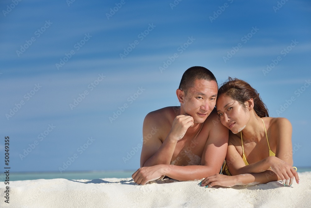 happy young couple enjoying summer on beach happy young couple enjoying summer on beach