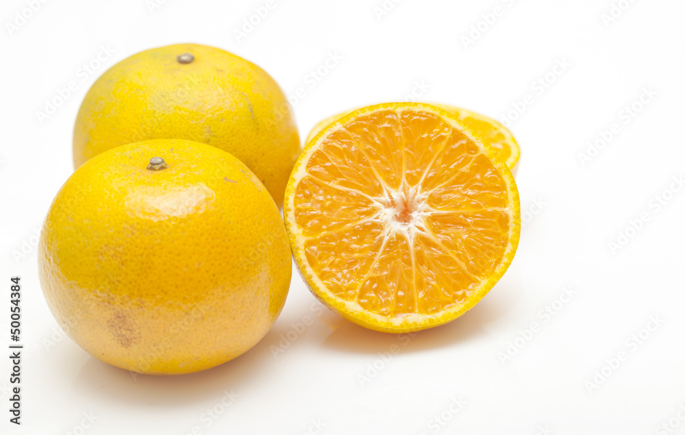 Orange juice and oranges isolated on white background