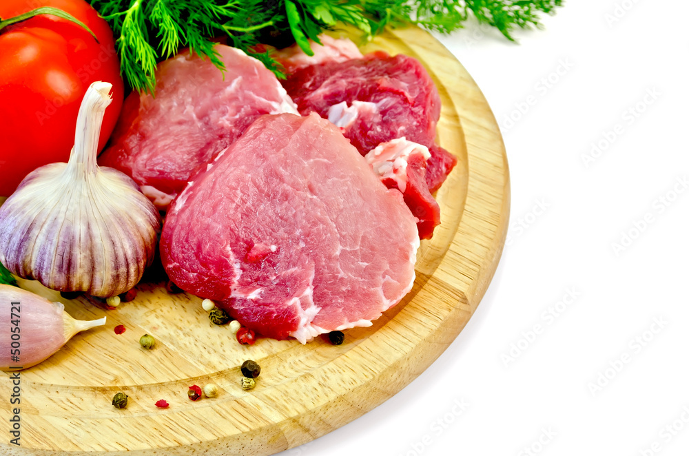 Meat slices on a round plate with vegetables Meat slices on a round plate with vegetables