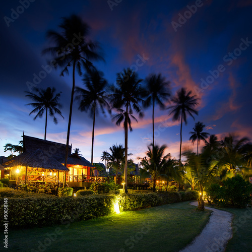 Bungalows at sunset in thailand paradise