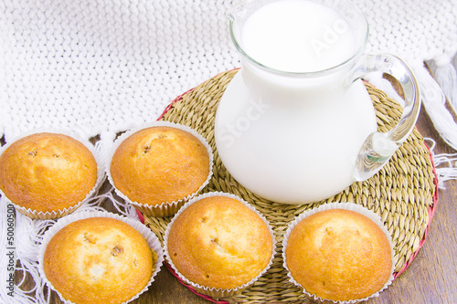 sweet vanilla domestic cakes and carafe with milk