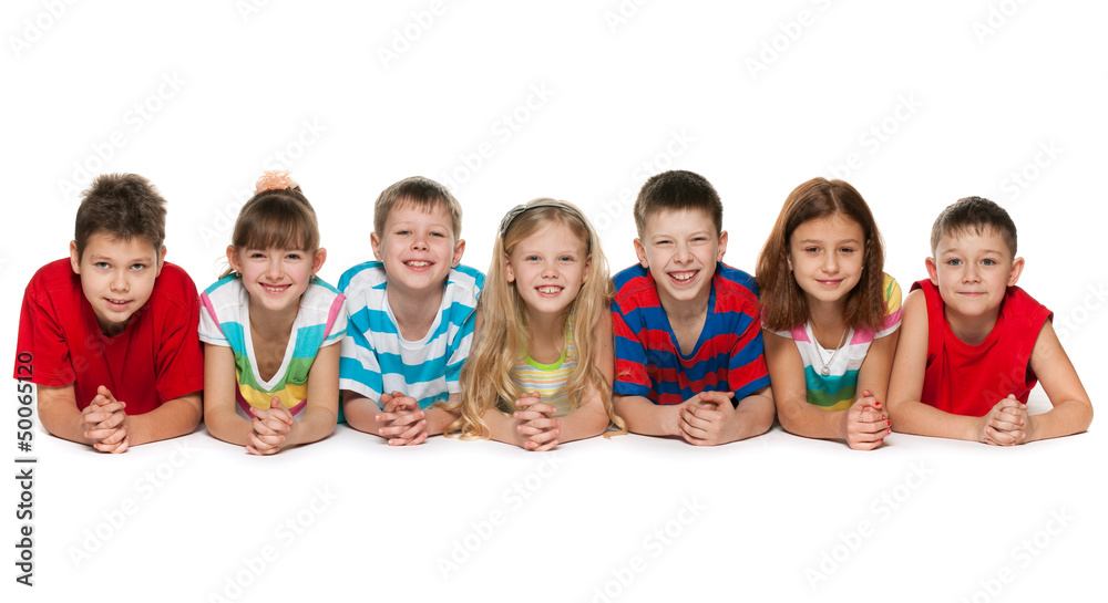 Seven children lying on floor Seven children lying on floor