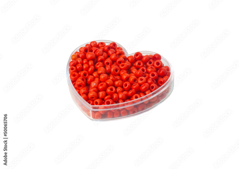 Red beads in a glass box in the form of heart Red beads in a glass box in the form of heart