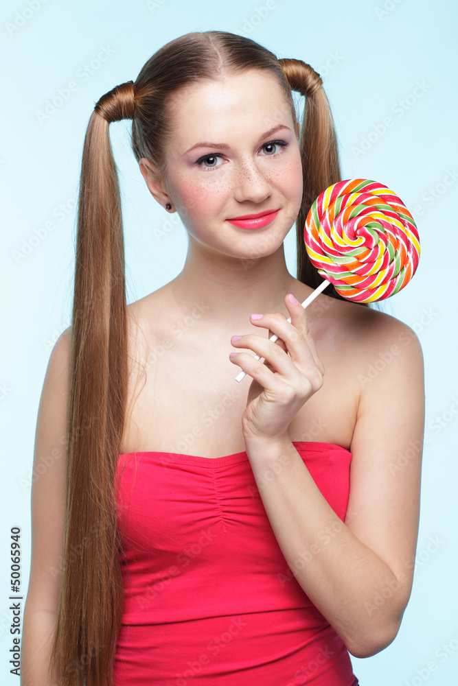 Young woman with lollipop