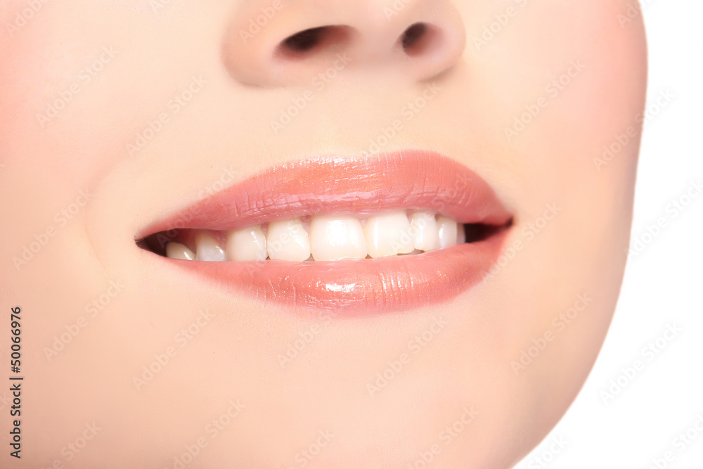 Woman smiling with teeth isolated on white background Woman smiling with teeth isolated on white background