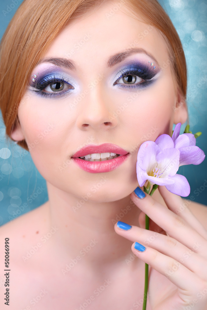 Beautiful young woman with glamour make up and flower Beautiful young woman with glamour make up and flower