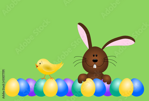 Osterhase mit Küken und bunten Ostereiern