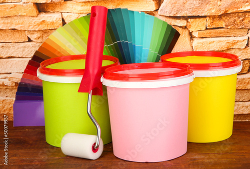 Set for painting: paint pots, paint-roller, palette of colors © Africa Studio