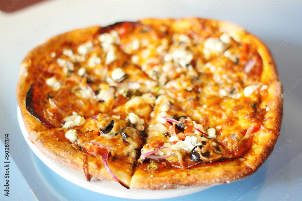 Delicious hot and fresh pizza from the oven. Delicious hot and fresh pizza from the oven.
