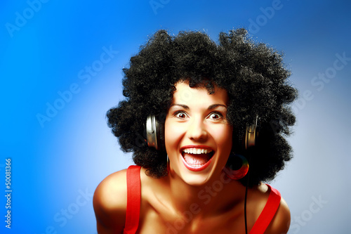 Happy woman with afro hairstyle wear headphones