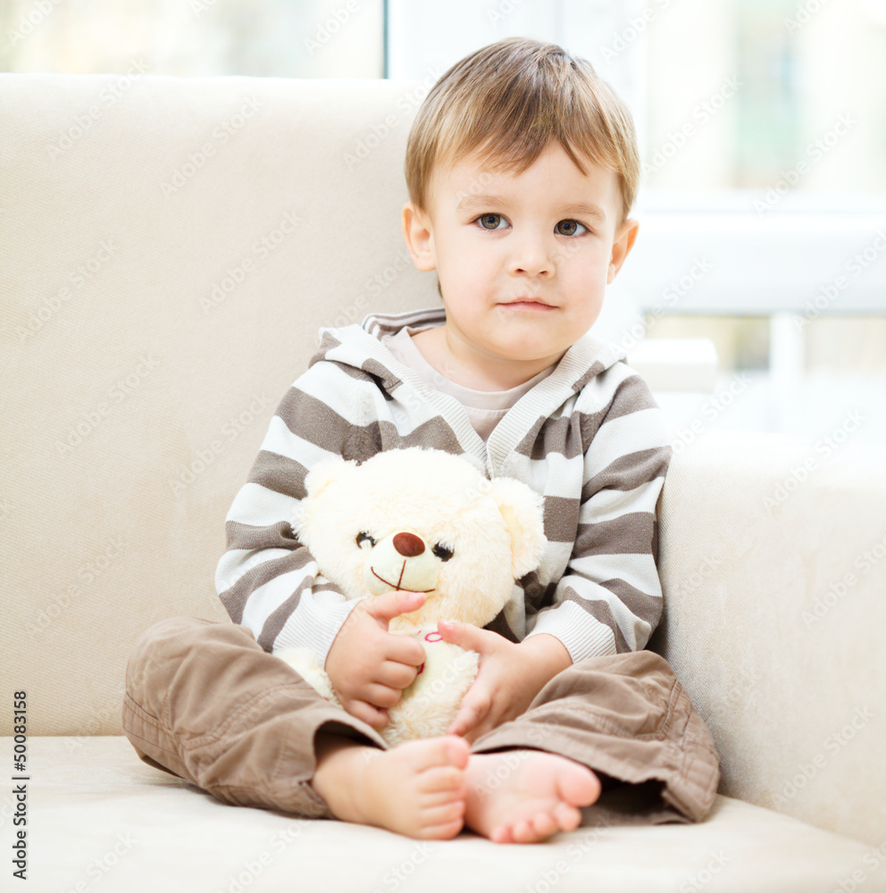 Portrait of a little boy with his teddy bear Portrait of a little boy with his teddy bear
