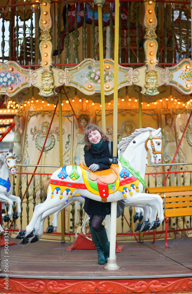 Young pretty girl on a Parisian merry-go-round