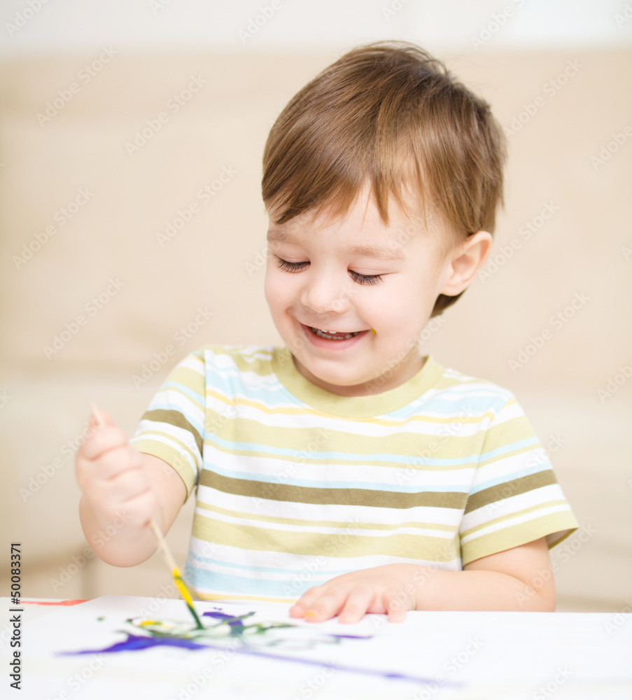 Little boy is playing with paints Little boy is playing with paints