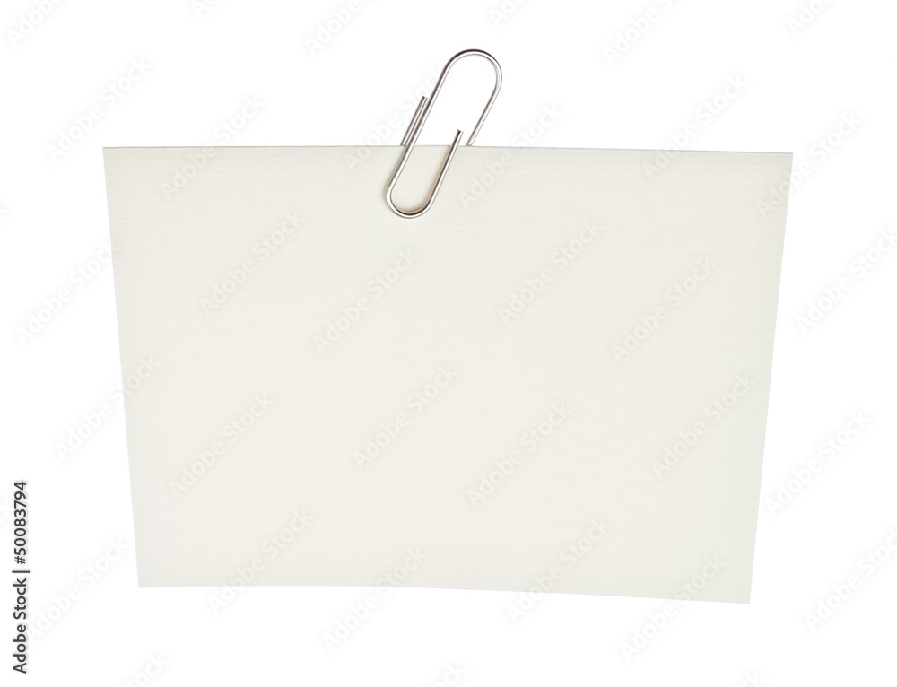 Office paper clip on a piece of paper. On a white background. Office paper clip on a piece of paper. On a white background.