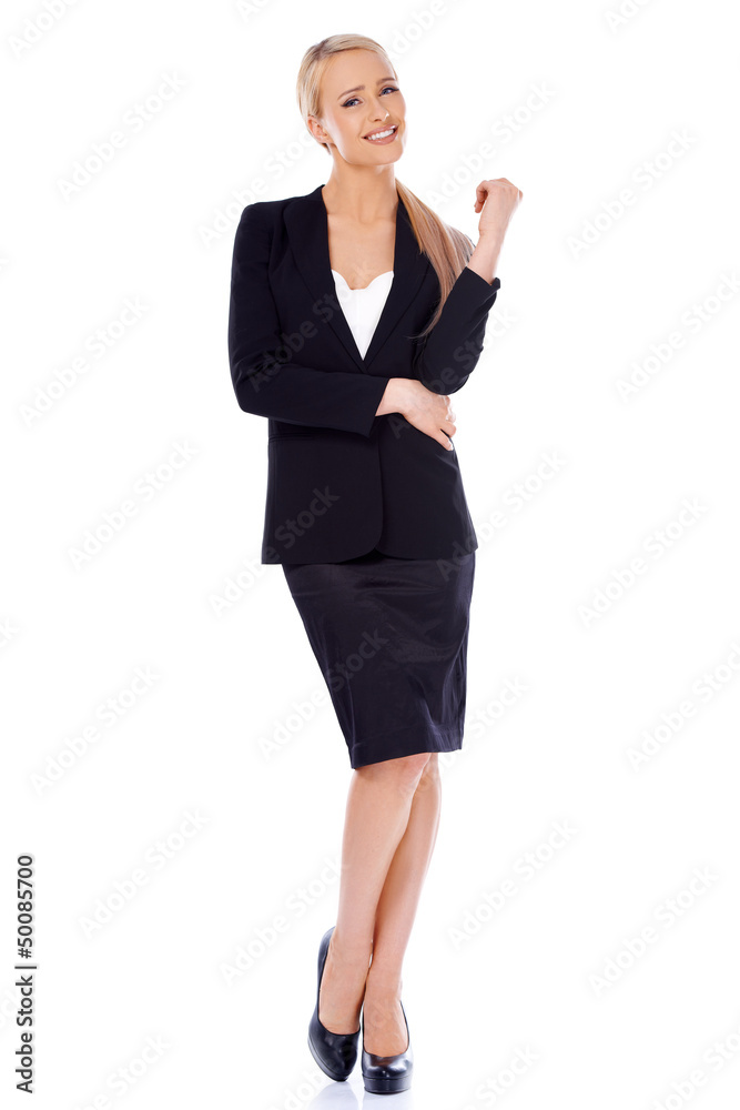 Blond smiling businesswoman standing isolated on white Blond smiling businesswoman standing isolated on white