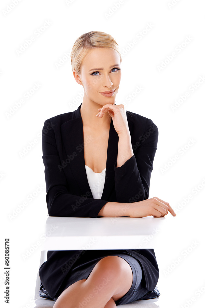 Adorable blond business woman sitting at desk Adorable blond business woman sitting at desk
