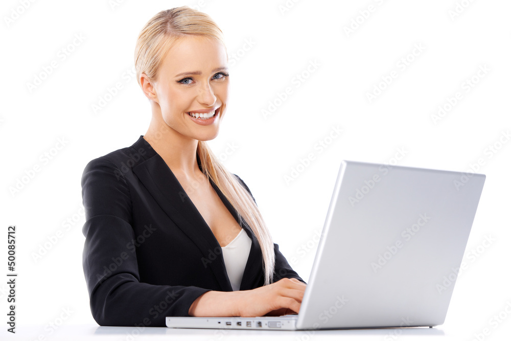 Cute blond business woman working on laptop Cute blond business woman working on laptop