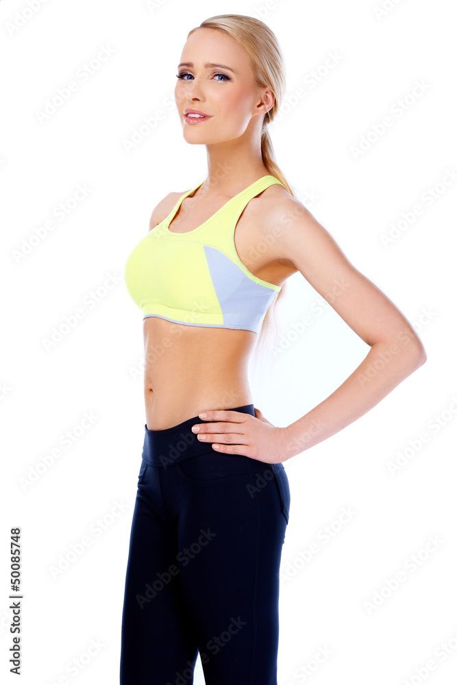 Sexy and slim blond woman standing on white Sexy and slim blond woman standing on white