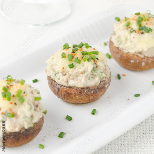 Stuffed mushrooms, baked with cheese and herbs, selective focus