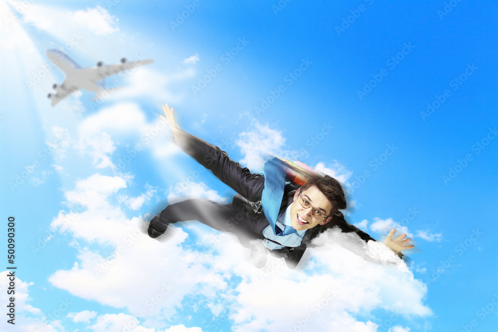 Young businessman flying with parachute on back Young businessman flying with parachute on back