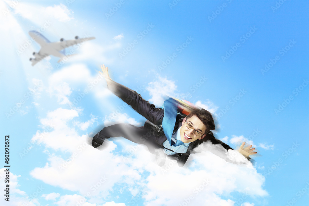 Young businessman flying with parachute on back Young businessman flying with parachute on back