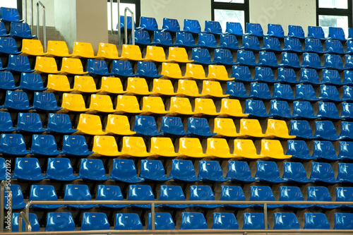 Seats in basketball stadium .