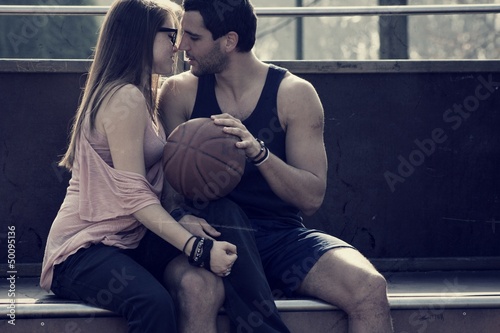 Beautiful young couple, kissing after physical activity photo