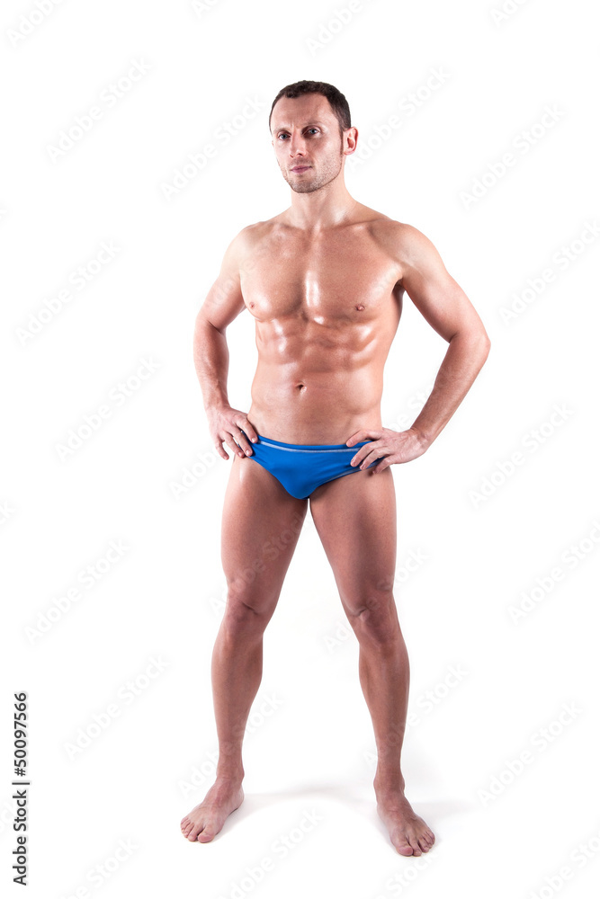 Young man wearing swimsuit isolated over white background. Young man wearing swimsuit isolated over white background.