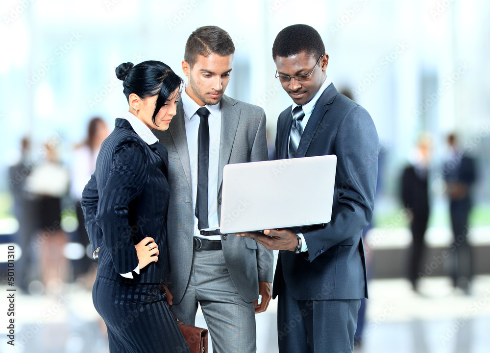 Happy business man holding a modern laptop computer Happy business man holding a modern laptop computer