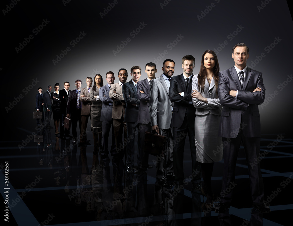 © ASDF - business team formed of young businessmen standing © ASDF - business team formed of young businessmen standing