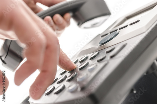 Dialing a phone number closeup photo