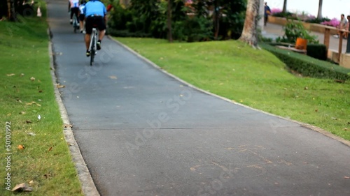 Wallpaper Mural Riding  bicycle and jogging on seperate lane in public park Torontodigital.ca