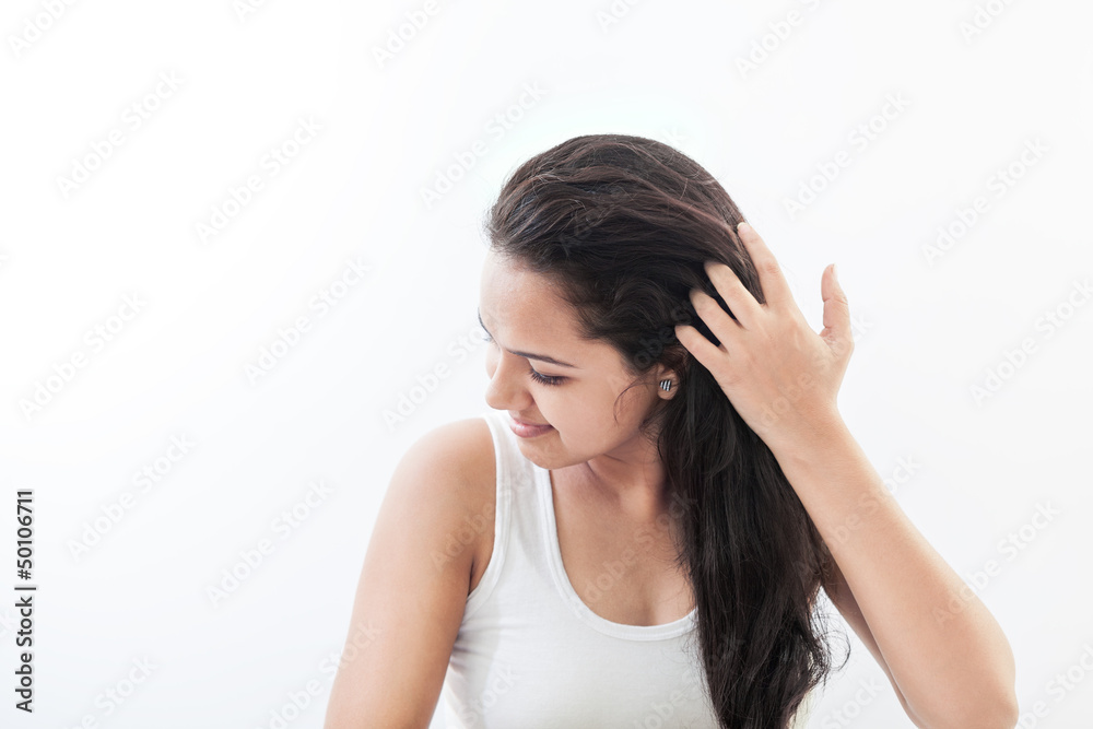 Beautiful Indian women styling her hair Beautiful Indian women styling her hair