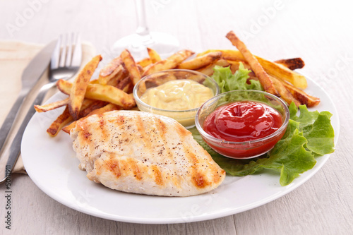 grilled meat with vegetable, and french fries