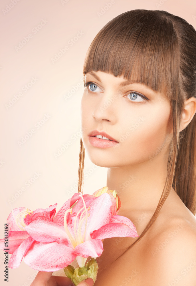 Fototapeta premium lovely woman with red lily flower