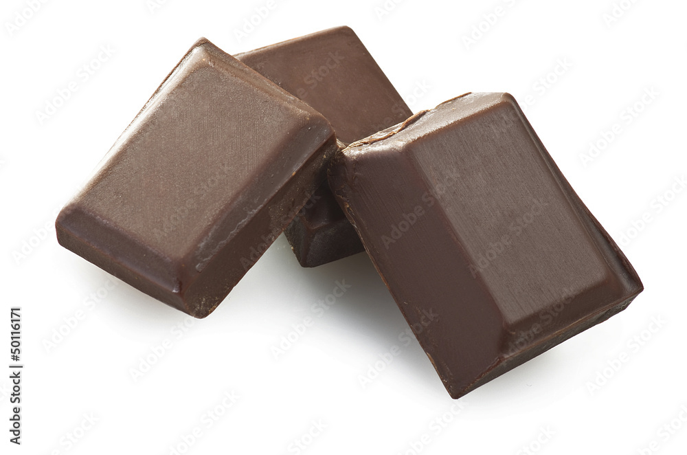 close up of chocolate pieces on white background close up of chocolate pieces on white background