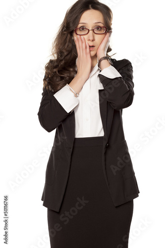 ashamed business woman posing on a white background