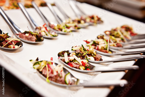a plate of finger food, typically seen at a function
