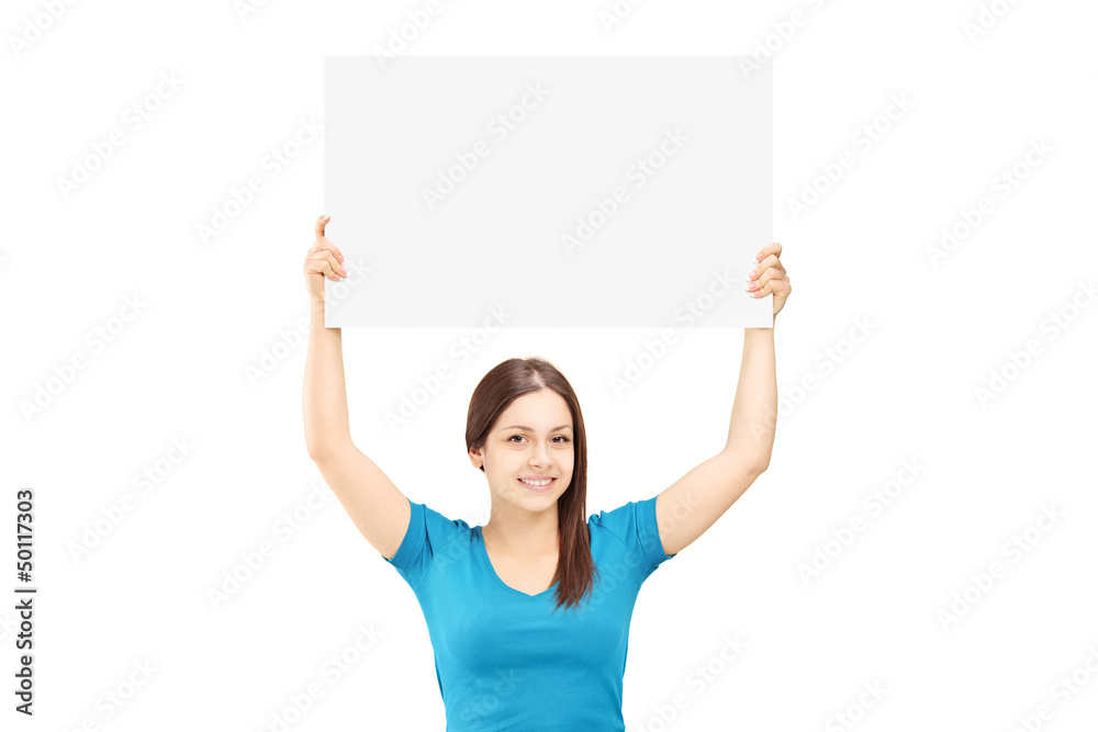 Beautiful young female holding a white panel above her head Beautiful young female holding a white panel above her head
