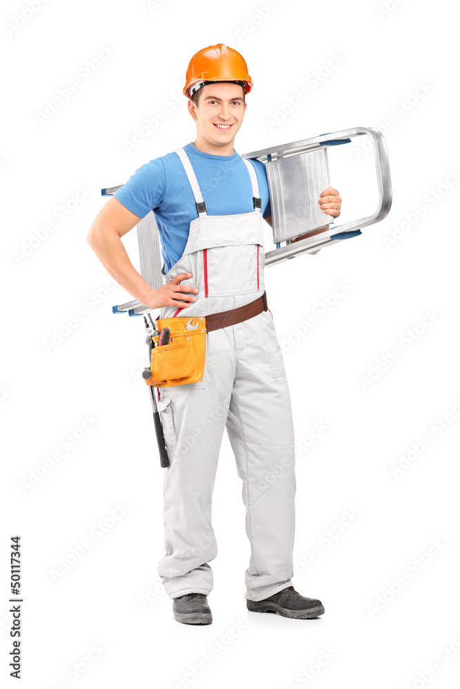 Full length portrait of a manual worker with a helmet carrying a Full length portrait of a manual worker with a helmet carrying a