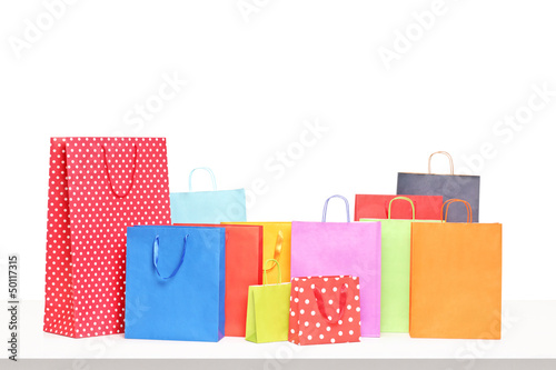 Colorful shopping bags on a table