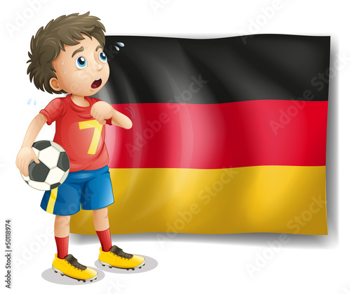 A soccer player in front of a flag