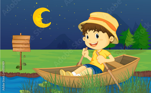 A boy riding in a boat