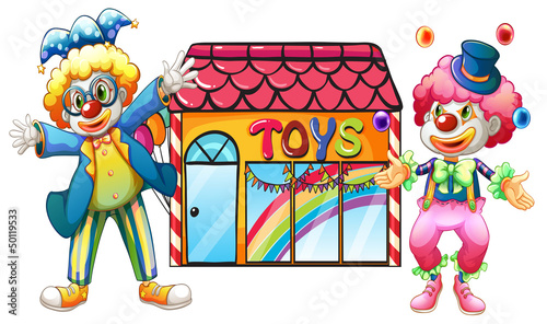 Two clowns in front of a toy store