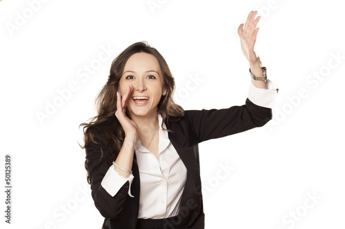 satisfied and happy woman shouting with both hands next to the m