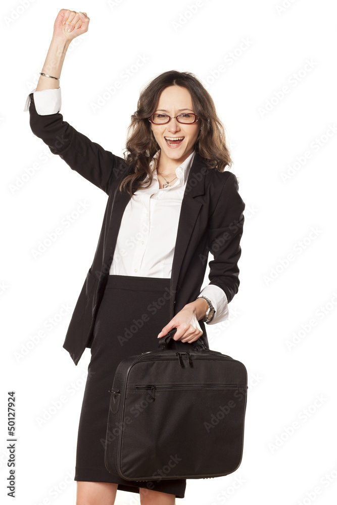 nice business woman with laptop bag exulting with a hand up nice business woman with laptop bag exulting with a hand up