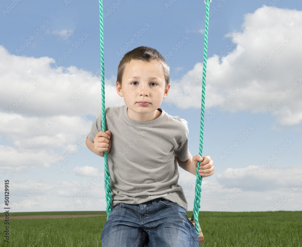 little boy on a swing little boy on a swing